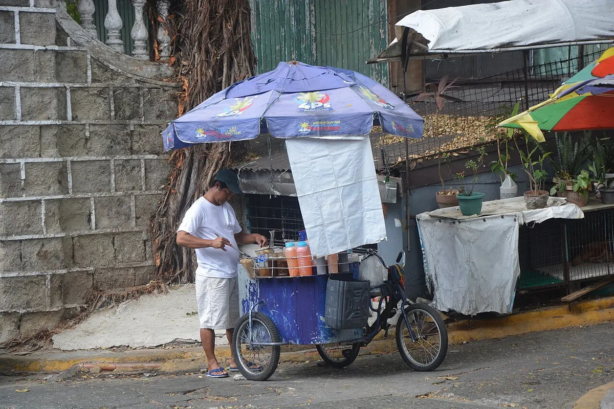 Street food stall selling affordable Filipino meals