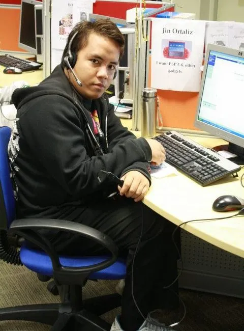 Filipino BPO call center worker at his workstation