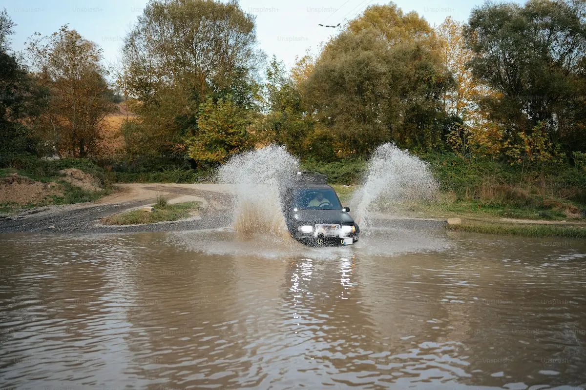 Flooded street with stranded vehicles